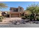 Beautiful two-story home with a welcoming front yard and attached two-car garage at 18381 N 93Rd St, Scottsdale, AZ 85255