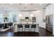 Modern kitchen featuring a large island, white cabinets, and marble countertops at 18381 N 93Rd St, Scottsdale, AZ 85255