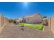 Backyard oasis boasts putting green, gazebo, and ample space for activities at 21754 E Caldwells Ct, Queen Creek, AZ 85142