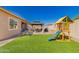 Enjoy outdoor fun with a playground and plenty of space in the backyard at 21754 E Caldwells Ct, Queen Creek, AZ 85142