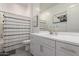 Bright bathroom featuring modern vanity, gray flooring, and shower with a stylish patterned curtain at 21754 E Caldwells Ct, Queen Creek, AZ 85142