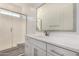 Modern bathroom features framed mirror, walk-in shower with glass doors, and white cabinets at 21754 E Caldwells Ct, Queen Creek, AZ 85142