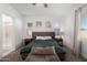 This bedroom features neutral walls and a large window allowing for ample natural light at 21754 E Caldwells Ct, Queen Creek, AZ 85142