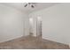 Neutral bedroom showcases ceiling fan, carpet floors, and a closet at 21754 E Caldwells Ct, Queen Creek, AZ 85142