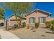 Charming single-story home featuring a well-maintained yard, desert landscaping, and a two-car garage at 21754 E Caldwells Ct, Queen Creek, AZ 85142