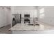 Bright kitchen features stainless steel appliances, granite countertops, and white cabinetry at 21754 E Caldwells Ct, Queen Creek, AZ 85142