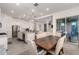 Open-concept kitchen featuring stainless steel appliances, granite countertops, and a view into the living room at 21754 E Caldwells Ct, Queen Creek, AZ 85142