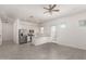 Bright kitchen featuring stainless appliances, white cabinets, island, and open to the living area at 21754 E Caldwells Ct, Queen Creek, AZ 85142
