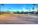 Well-maintained tennis court with mountain backdrop at 22843 W Moonlight Path, Buckeye, AZ 85326