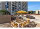 Outdoor grilling area with tables and chairs for entertaining at 2323 N Central Ave # 502, Phoenix, AZ 85004