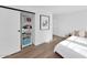 Bright bedroom features luxury vinyl floors, recessed lights, and sliding closet doors at 2323 N Central Ave # 502, Phoenix, AZ 85004