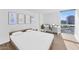 Bright bedroom with city view, a modern desk, and hardwood floors, providing a peaceful and productive space at 2323 N Central Ave # 502, Phoenix, AZ 85004