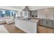 Modern kitchen with an island, gray cabinets, and stainless steel appliances offers a stylish and functional cooking space at 2323 N Central Ave # 502, Phoenix, AZ 85004