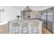 Modern kitchen featuring stainless steel appliances, gray cabinets and a large central island and modern fixtures at 2323 N Central Ave # 502, Phoenix, AZ 85004