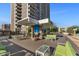 Relaxing community patio with seating, fire pit, and city views at 2323 N Central Ave # 502, Phoenix, AZ 85004