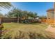 Fenced backyard with grassy area and playset at 2403 W Via Dona Rd, Phoenix, AZ 85085