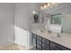 Bathroom with dual vanity and updated fixtures at 2403 W Via Dona Rd, Phoenix, AZ 85085