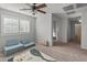 Spacious bedroom with built-in seating and access to hallway bathroom at 2403 W Via Dona Rd, Phoenix, AZ 85085