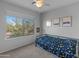 Cozy bedroom with daybed and large window at 2403 W Via Dona Rd, Phoenix, AZ 85085