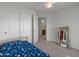 Spacious bedroom with a bed, closet, and storage at 2403 W Via Dona Rd, Phoenix, AZ 85085