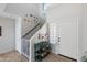 Bright entryway with staircase, storage, and console table at 2403 W Via Dona Rd, Phoenix, AZ 85085