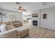 Spacious living room with L-shaped sofa and view of kitchen at 2403 W Via Dona Rd, Phoenix, AZ 85085