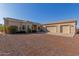 House with three-car garage and gravel driveway at 29433 N 155Th Ave, Surprise, AZ 85387