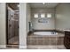 Primary bathroom with walk-in shower and a large soaking tub at 30407 N 54Th St, Cave Creek, AZ 85331