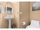 Small bathroom with pedestal sink and toilet at 3054 W Eagle Claw Dr, Phoenix, AZ 85086