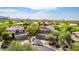 Aerial view of a residential neighborhood with mountain backdrop at 3060 N Ridgecrest -- # 98, Mesa, AZ 85207