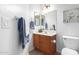 Clean bathroom with wood vanity and large mirror at 3060 N Ridgecrest -- # 98, Mesa, AZ 85207