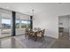 Bright dining room with mountain views and glass table at 3132 W Blue Eagle Ln, Phoenix, AZ 85086