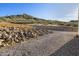 Gravel and rock landscaping surrounding a new home at 3132 W Blue Eagle Ln, Phoenix, AZ 85086