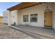 Covered porch with seating area, offering views of the desert landscape at 3132 W Blue Eagle Ln, Phoenix, AZ 85086