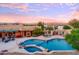 Stunning pool and spa with mountain views at sunset at 317 W Olesen Rd, Phoenix, AZ 85085