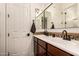 Modern bathroom with a double vanity and a sleek, frameless mirror at 32133 N 127Th Dr, Peoria, AZ 85383