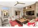 Living room with wood floors and sliding barn door at 34415 N 99Th Way, Scottsdale, AZ 85262