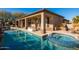 Luxury backyard with a large pool, spa, and expansive patio at 34415 N 99Th Way, Scottsdale, AZ 85262