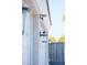 White two-car garage with decorative lanterns at 3528 E Decatur St, Mesa, AZ 85213