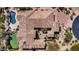 Large home with tile roof, pool, and courtyard, aerial view at 37181 N 103Rd St, Scottsdale, AZ 85262