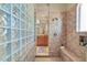 Spacious bathroom with large shower and glass block feature wall at 37181 N 103Rd St, Scottsdale, AZ 85262