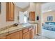 Bathroom with wood cabinets and tiled countertop at 37181 N 103Rd St, Scottsdale, AZ 85262
