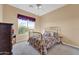 Bedroom with brass bed frame and window at 37181 N 103Rd St, Scottsdale, AZ 85262