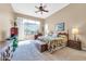 Spacious bedroom with plush carpet and large windows at 37181 N 103Rd St, Scottsdale, AZ 85262