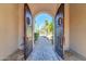 Pathway through arched entryway to desert landscape at 37181 N 103Rd St, Scottsdale, AZ 85262