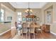 Bright dining room with hardwood floors and a wood table at 37181 N 103Rd St, Scottsdale, AZ 85262