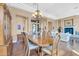 Elegant dining room with hardwood floors and a large wood table at 37181 N 103Rd St, Scottsdale, AZ 85262