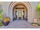 Front entry with double doors and arched entryway at 37181 N 103Rd St, Scottsdale, AZ 85262
