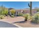 Single-story home with desert landscaping and a three-car garage at 37181 N 103Rd St, Scottsdale, AZ 85262