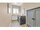 Laundry room with washer, dryer, and cabinets at 37181 N 103Rd St, Scottsdale, AZ 85262